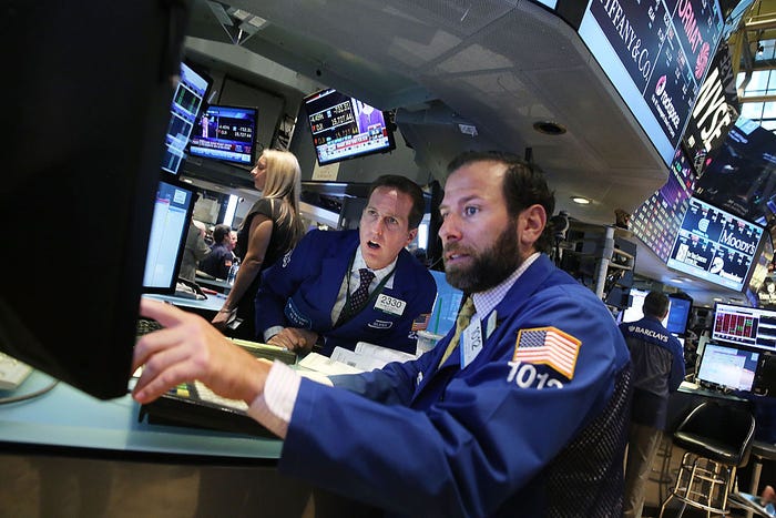 Traders work on the floor of the New York Stock Exchange (NYSE)