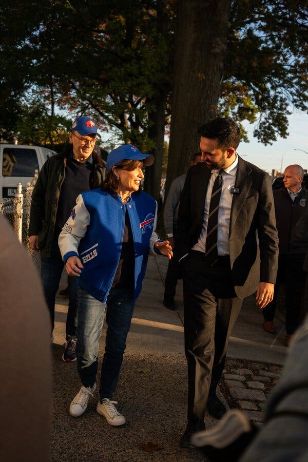 Mr. Mamdani walks with Gov. Kathy Hochul on a fall afternoon, the governor wearing Buffalo Bills regalia.