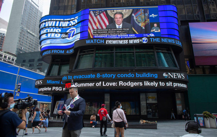 News coverage on a Times Square screen announcing Gov. Andrew Cuomo’s resignation in 2021.