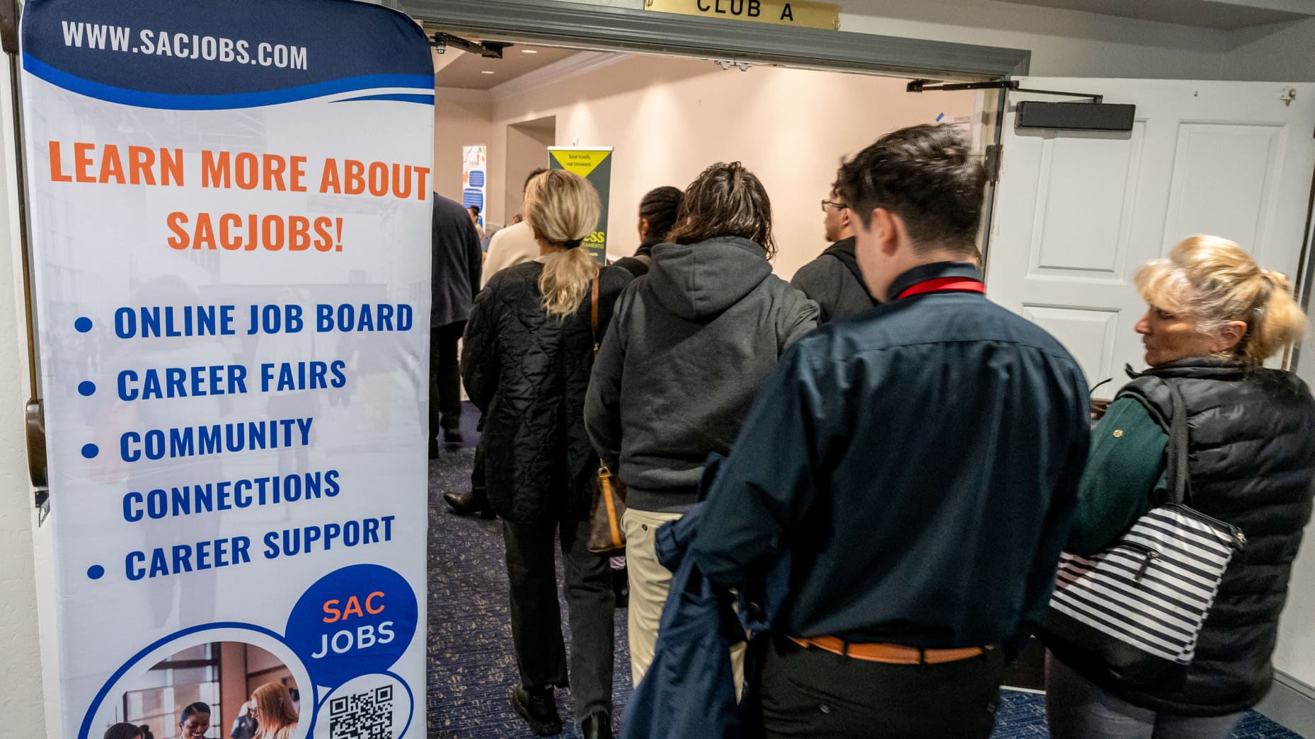 Job seekers wait to enter the SacJobs Career job fair in Sacramento, California, US, on Thursday, Nov. 13, 2025. The October jobs report will be released without a reading of the unemployment rate, President Donald Trump's top economic adviser said Thursday. Photographer: David Paul Morris/Bloomberg via Getty Images