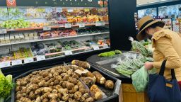 A woman shops for produce at a supermarket in Alhambra, California, on September 10, 2025.