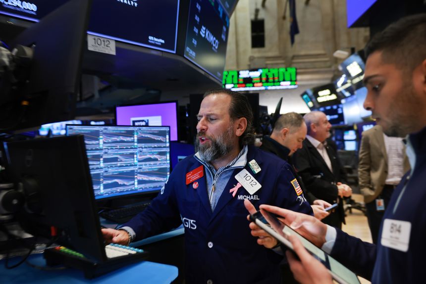 Traders work on the floor of the New York Stock Exchange.