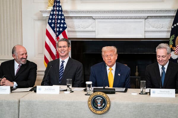 Howard Lutnick, Scott Bessent, President Trump and David Sacks seated behind a table.