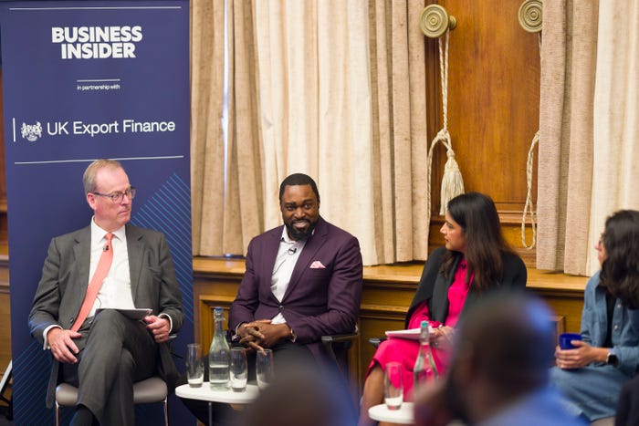 three people on a panel talk