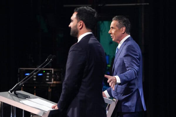 Andrew Cuomo extended his left arm toward Mr. Mamdani, gesturing during the second mayoral debate.