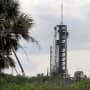 A SpaceX Falcon 9 rocket and Dragon spacecraft sit on the pad at Launch Complex 39A at NASA's Kennedy Space Center.