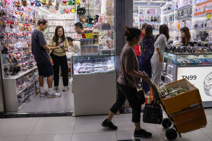 People shopping at a mall in Shenzhen, China.