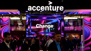 Congress visitors passing by the Accenture stand at Mobile World Congress 2023.