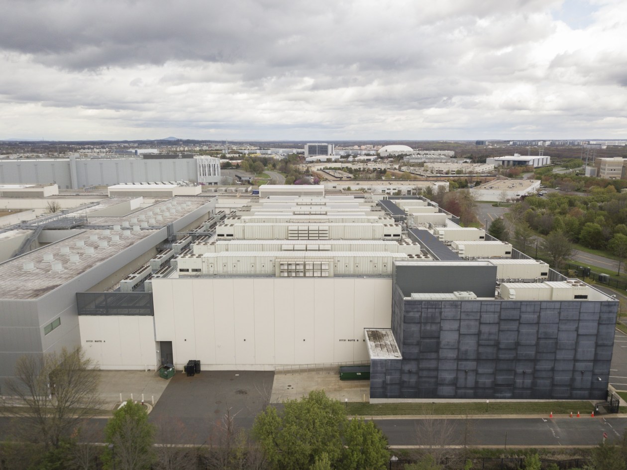 Aerial view of the Equinix DC11 Data Center in Loudoun County, Virginia, showing cooling systems on the roofs of multiple large buildings.