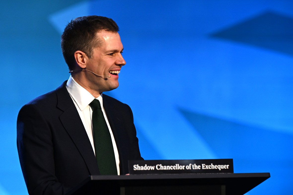 Robert Jenrick smiling while speaking as Shadow Chancellor of the Exchequer.