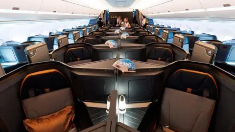 Getty Images Business class seats onboard an Airbus SE A350-1000 aircraft operated by Starlux Airlines Co. during the Singapore Airshow in Singapore