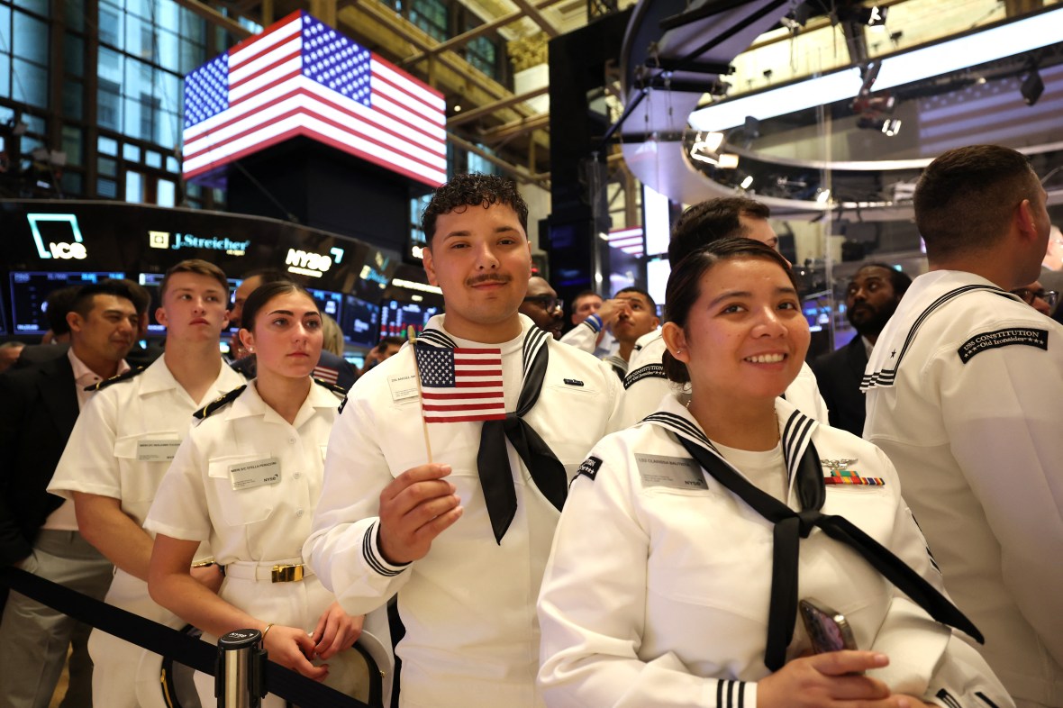 Military personnel from the USS Constitution at the New York Stock Exchange.