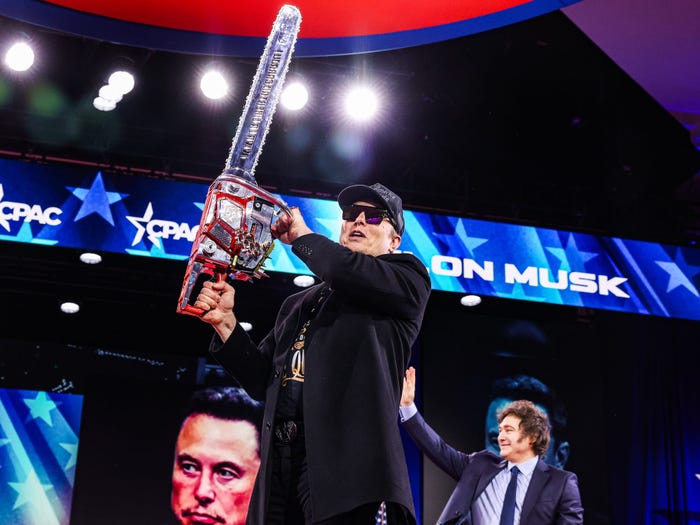 Elon Musk wielding a chainsaw at the Conservative Political Action Conference in February.