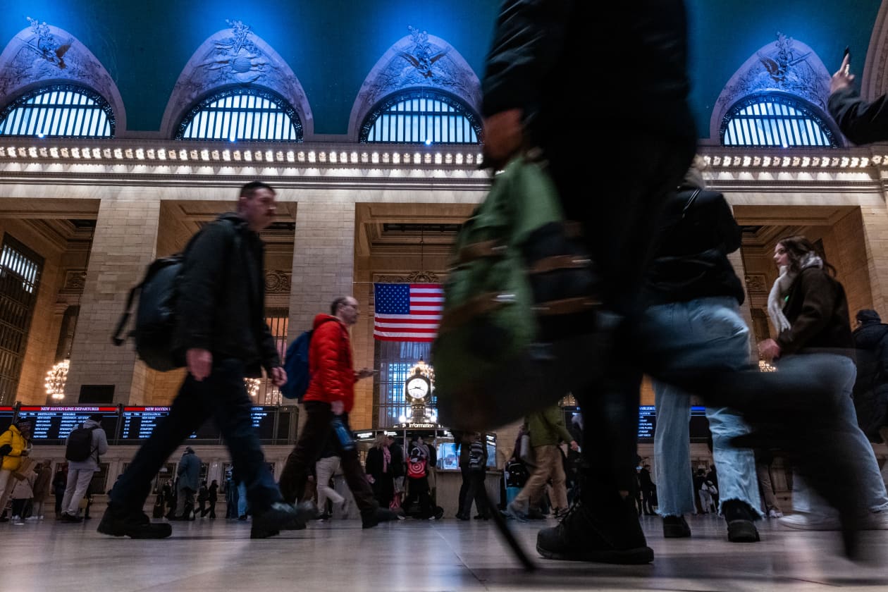 People walking through Grand Central Terminal in New York City.