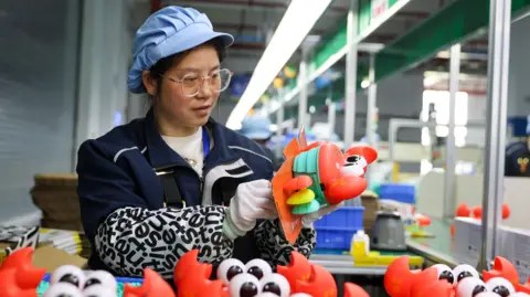 VCG via Getty Images Workers produce baby supplies to meet overseas demand at the workshop of baby products enterprise on March 10, 2026 in Jiujiang, Jiangxi Province of China.