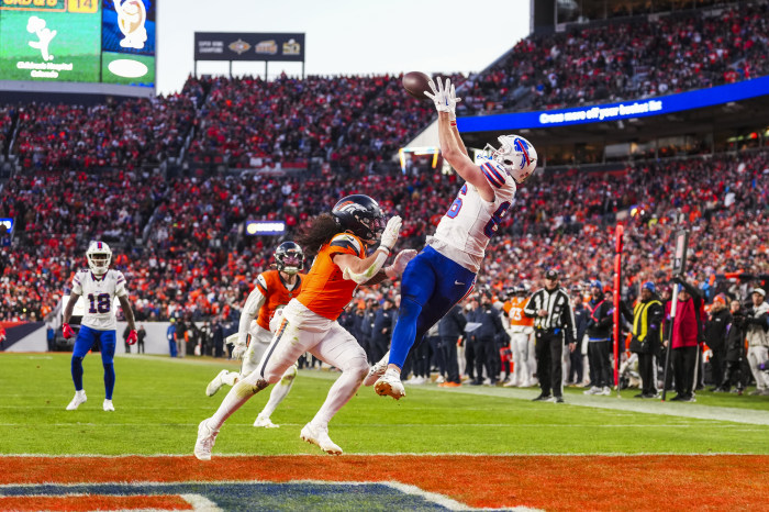 Dalton Kincaid of the Buffalo Bills making a catch during an NFL playoff football game.