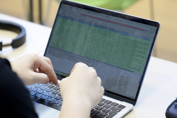 person typing on a computer