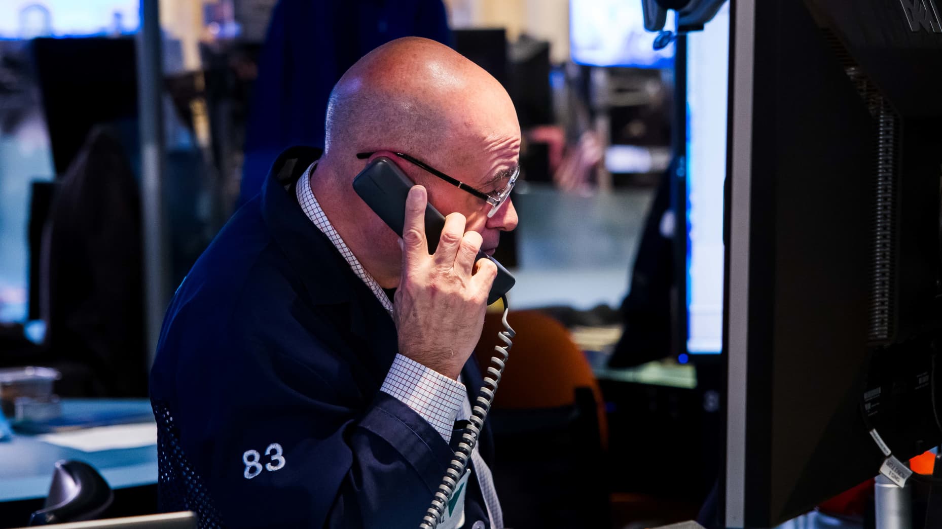 Trades work at the New York Stock Exchange on Jan. 16, 2026.