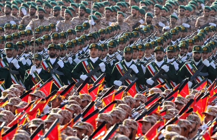 Iran’s Islamic Revolutionary Guard Corps soldiers marching in formation at an annual military parade in Tehran.