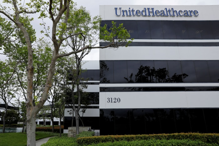 The corporate logo of UnitedHealthcare on the side of one of their office buildings.
