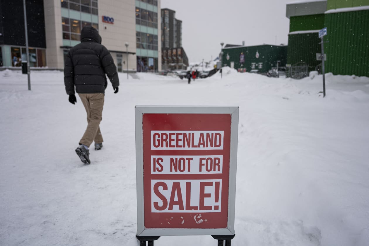 A "Greenland is not for sale" sign in front of a clothing shop in Nuuk, Greenland.