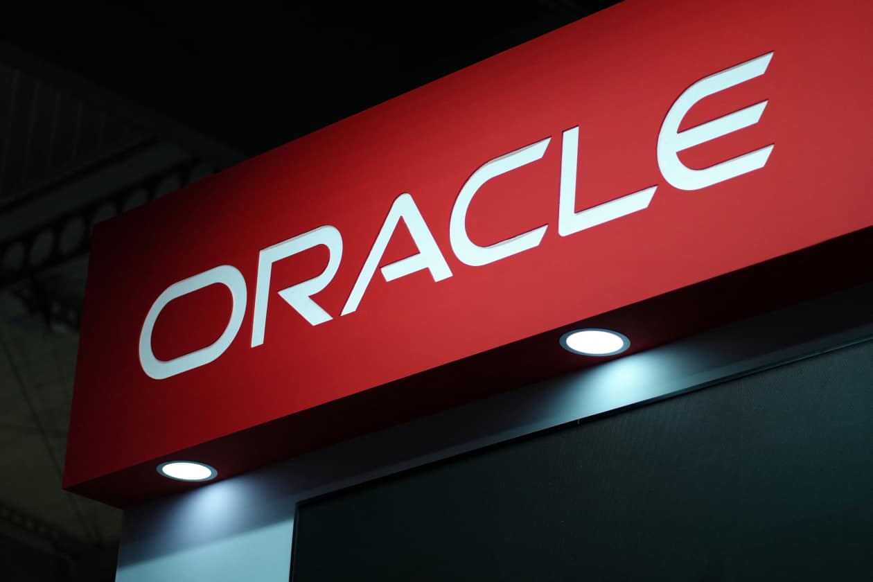 The Oracle logo on a red sign at Mobile World Congress.
