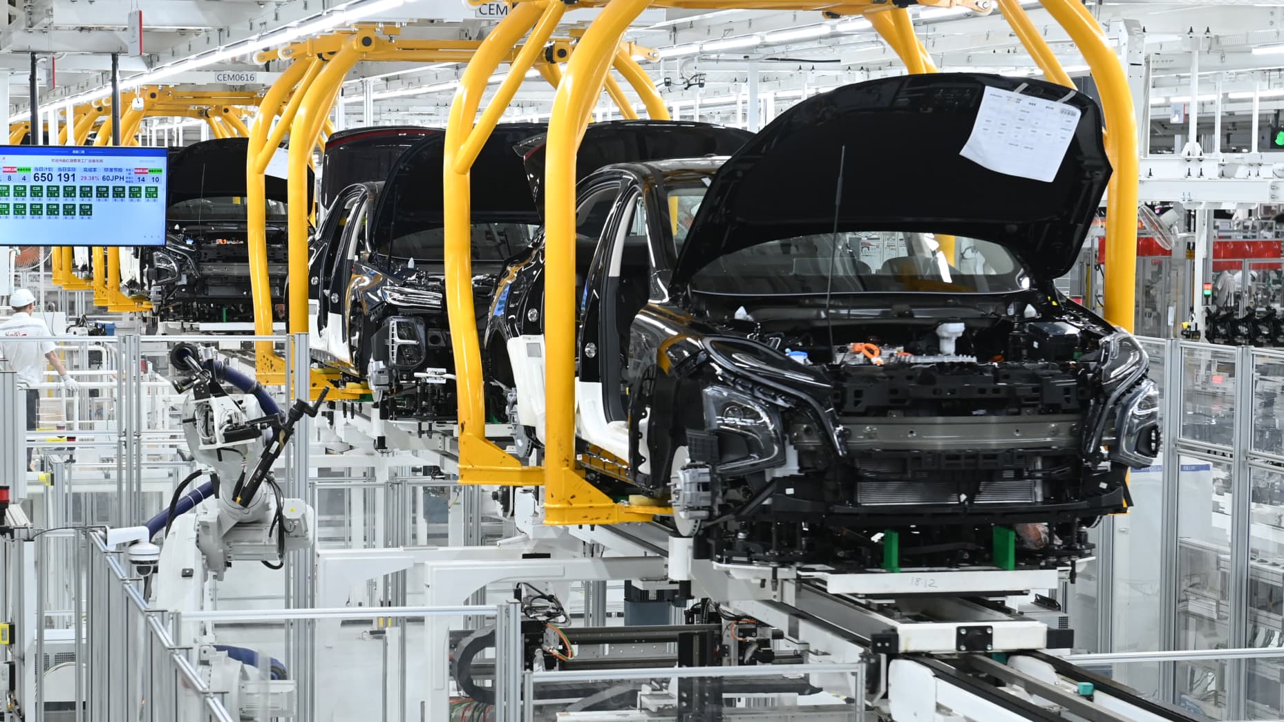 CHANGCHUN, CHINA - JULY 05: Car bodies on the assembly line of new energy vehicles (NEVs) at a workshop of China FAW Group's Hongqi Fanrong Plant on July 5, 2023 in Changchun, Jilin Province of China. (Photo by Zhang Yao/China News Service/VCG via Getty Images)