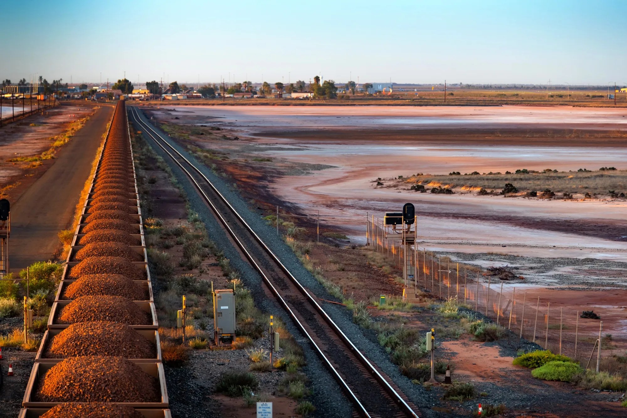 Wagons Of Iron Ore Make Their Way To Port By Rail And Road